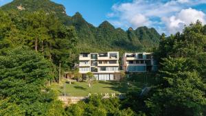 a large building in the middle of a mountain at Pandora Annica Villa in Zhangjiajie