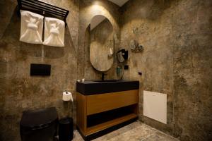 a bathroom with a sink and a mirror at Carpe Diem Hotel in Borsh +269 photos