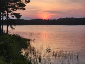 a sunset over a large body of water at Orange Lake Airstream in Whiting