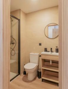 a bathroom with a toilet and a sink and a mirror at micampus Logroño Centro in Logroño +13 photos