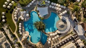 an overhead view of a swimming pool at a resort at Mediterranean Beach Hotel in Limassol