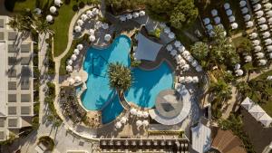 an overhead view of a swimming pool at a resort at Mediterranean Beach Hotel in Limassol