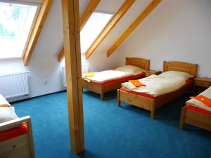 Ένα ή περισσότερα κρεβάτια σε δωμάτιο στο Pension Mandl