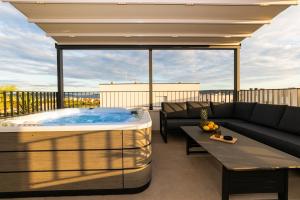 a hot tub on the roof of a house at Penthouse Petar in Kastel Stari