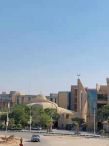 a parking lot in a city with a building at Sami apartment in Alexandria