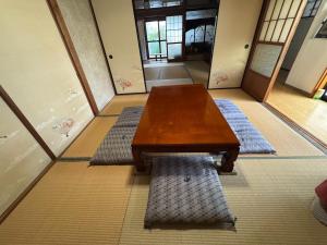 a wooden table in the middle of a room at Kouan 功庵 in Matsuyama