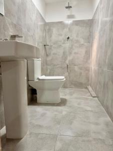 a bathroom with a toilet and a sink at Villa 87 - Anuradhapura in Anuradhapura