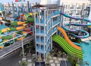 an image of a water park with a water slide at Pentapolis Apartment Balikpapan Superblock LT4 in Balikpapan