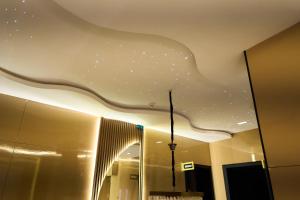 a room with a ceiling with stars on it at Apartment60 in Lagos