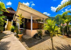 a house with a lot of plants in front of it at SU house Koh Phangan in Thong Nai Pan Yai