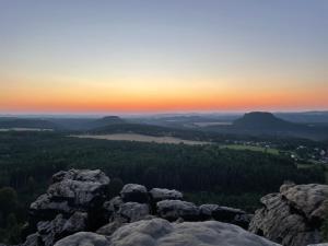 a view from the top of a mountain at sunset at Am Holundergrund in Kurort Gohrisch