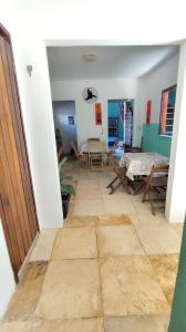 a view of a room with a table and chairs at Pousada Preguiça in Canoa Quebrada