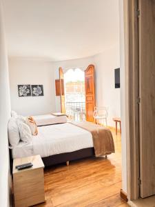 a bedroom with a bed and a balcony at Casa Real Circacia in Circasia +28 photos