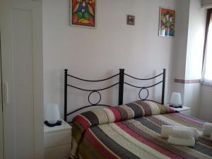 A bed or beds in a room at B&B La Cubanina