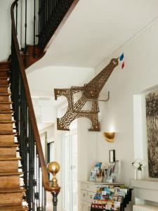 a staircase in a house with a giraffe on the wall at Hotel de Paris in La Rochelle