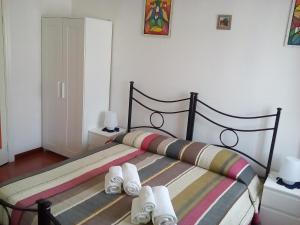 A bed or beds in a room at B&B La Cubanina