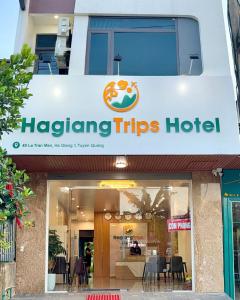 a sign for a haggling trips hotel at HagiangTrips Hotel in Ha Giang