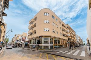 a tall building on a city street at Sunrise Arts 1 in Torrevieja