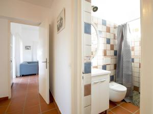 a bathroom with a toilet and a sink at Casa Rita in San Ferrán de ses Roques +30 photos