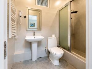 a bathroom with a toilet and a sink and a shower at Sochi Resort-Pine Garden Boutique Hotel and Pool Stepanavan in Stepʼanavan +37 photos