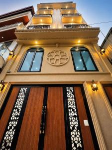 a building with three windows on top of it at Happy Hotel Phu Tho 