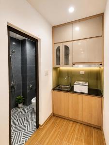 a bathroom with a sink and a shower at Happy Hotel Phu Tho 