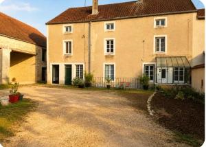 a large house with a driveway in front of it at Grand gîte convivial proche de Dijon in Marey-sur-Tille