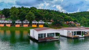 a row of houses on a body of water at Raya Buri Resort Kanchanaburi in Ban Hin Hak +53 photos