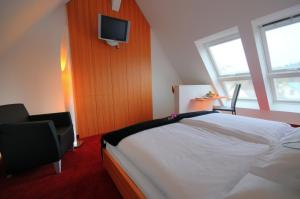 Säng eller sängar i ett rum på Hotel Antoniushütte