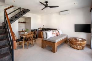 a living room with a couch and a table at Dream Nest Bali in Munggu