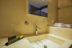a bathroom with a bath tub with a sink at Kyan Bay in Itea +61 photos