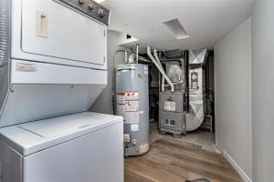 a small kitchen with a refrigerator and a stove at Bright 2 Bedroom Suite in Windsor