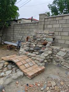 a brick oven in front of a brick wall at Hotel Manglisi Hills in Manglisi
