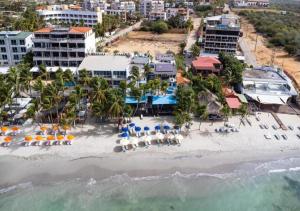 an aerial view of a beach with chairs and umbrellas at Yaque Breeze - Beach Apartament in El Yaque