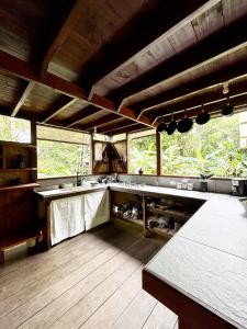 a large kitchen with a lot of counter tops at Casa Prana Nuquí in Nuquí