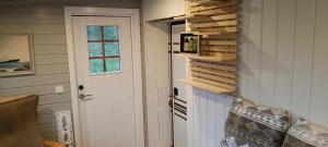 a room with a door and a window at Stetind Skicamp in Lyngen