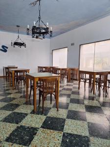 a room with tables and chairs and a projection screen at Hotel 7 De Septiembre in San Clemente del Tuyú +41 photos