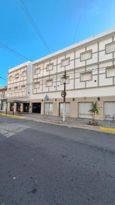 a large building on the side of a street at Hotel 7 De Septiembre in San Clemente del Tuyú