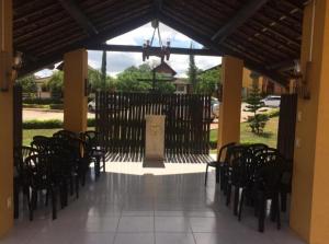 a group of chairs sitting inside of a building at Flat 705 Winterville - Gravatá in Gravatá