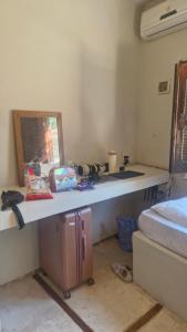 a kitchen with a counter and a sink in a room at Suíte privada in Jericoacoara