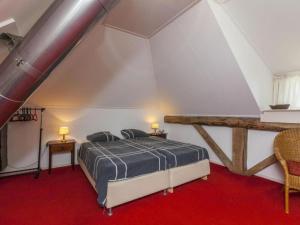 a bedroom with a bed in a attic at Hytte in Balkbrug +23 photos