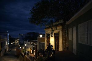a building with a street light on it at night at Twin Bed Room-King Room Zona Colonial in Santo Domingo