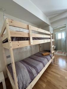 a wooden bunk bed in a small room with at movida beach in Bari +26 photos