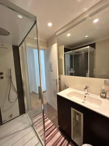 a bathroom with a sink and a shower at movida beach in Bari