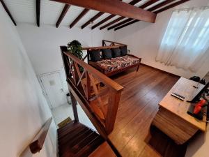a living room with a couch and a table at Apartamento em Maresias a 100 metros da praia in Maresias
