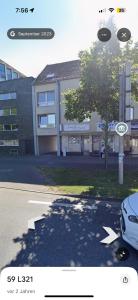 a picture of a building with a car parked in front at Comfortable Private Room in a Prime Location! HBF in Wolfsburg