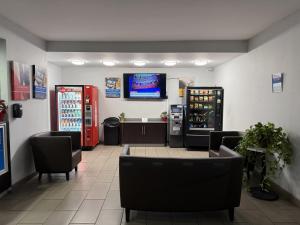 a fast food restaurant with a soda machine and a bar at Motel 6-Tucson, AZ-Downtown in Tucson