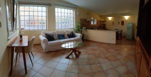 a living room with a couch and a table at Casa Mille Lire in Ciampino