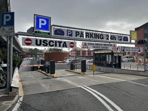 a street sign in front of a parking lot at Hotel Acquario in Genoa