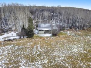 an aerial view of a house in a field at MTN Meadow Retreat near PC in Peoa